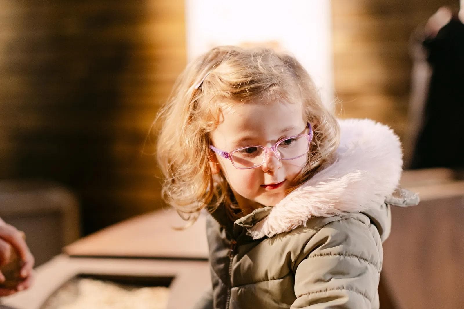 A young girl mixing magical reindeer food at Prancer's Pantry