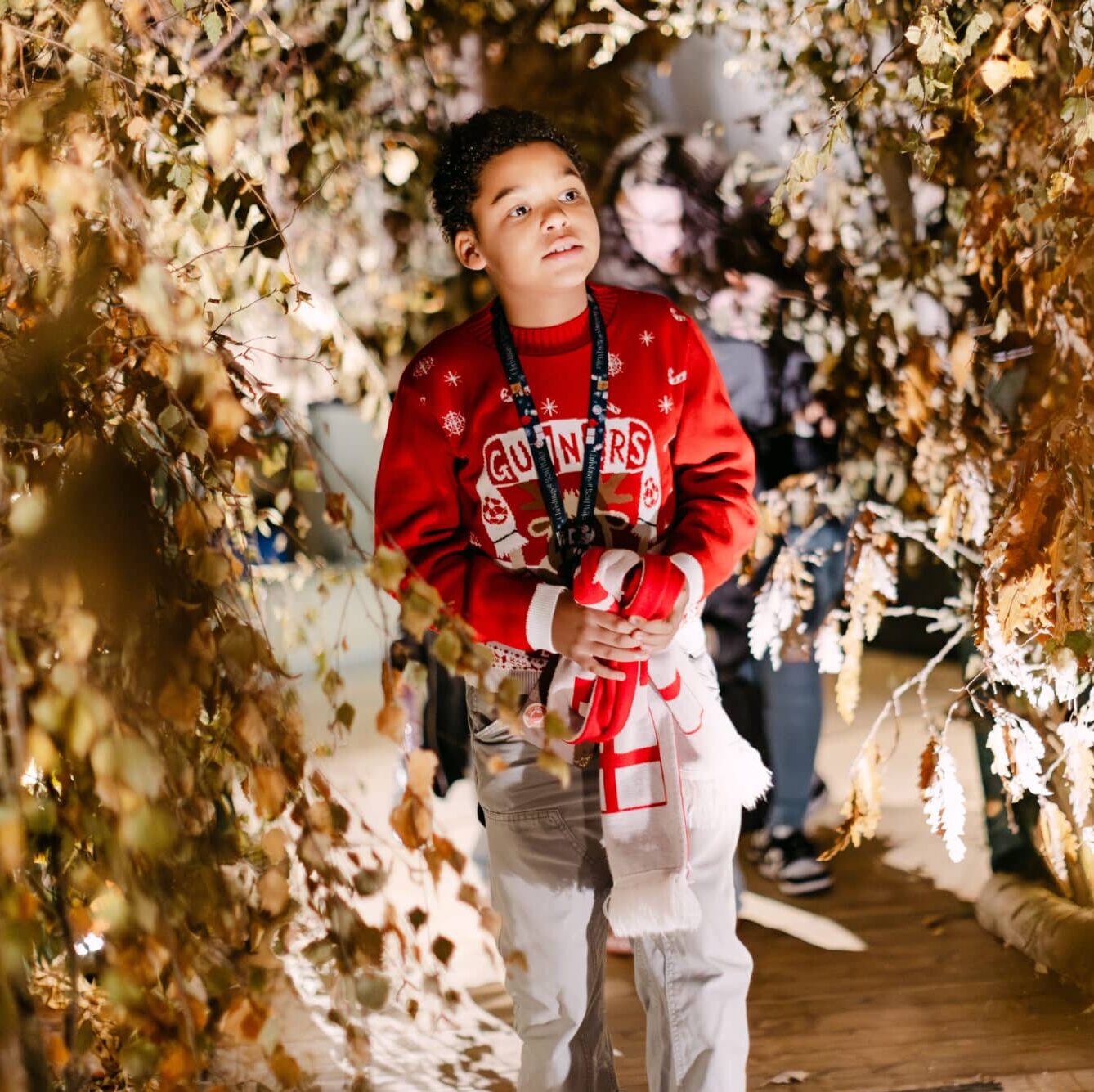 Child exploring the enchanting woodland trail at Christmas at Bewl Water, a magical immersive Christmas experience for families in Kent.
